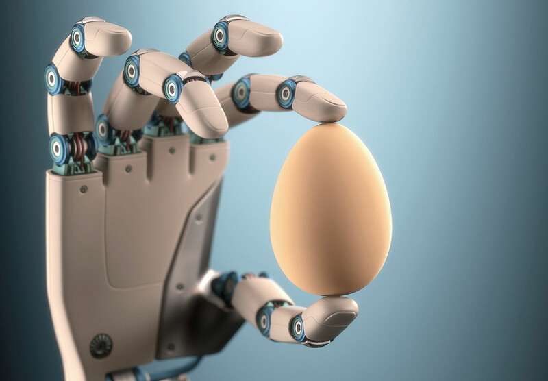 A robotic hand holding an egg